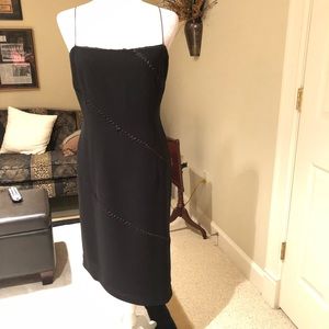 Black lined cocktail dress.